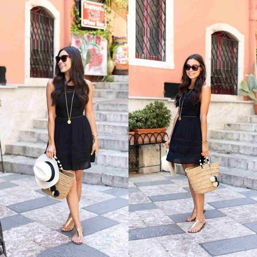 Mulher com rasteirinha dourada, vestido preto e uma bolsa na mão direita